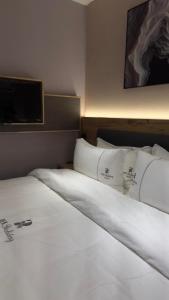 Postel nebo postele na pokoji v ubytování Rek Holiday Hotel