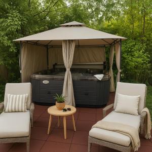 a gazebo with a hot tub in a backyard at Plaza Hotel Gyula in Gyula