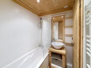 a bathroom with a sink and a mirror at La tanière des Chamois 7p - proche piste Chalvet in Montgenèvre +20 photos