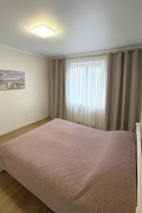 Giường trong phòng chung tại Апартамент Комфорт Кривий Ріг