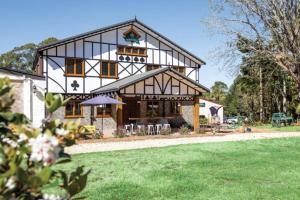 a large building with a green lawn in front of it at Zen-Inspired Hinoki Bath, Tatami and Washitsu Room in Eagle Heights