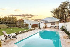 a swimming pool in the backyard of a house at Retreat on Chaffey in Mildura