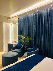 Ένα ή περισσότερα κρεβάτια σε δωμάτιο στο The Origin Suites DLF MY PAD +98 φωτογραφίες