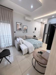 Ένα ή περισσότερα κρεβάτια σε δωμάτιο στο G&E Kavala Apartments