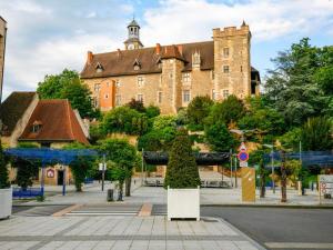 a large building with a tower on top of it at Lapeyrouse Bonnet in Montmirail