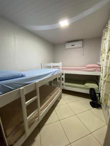 Кровать или кровати в номере Casa Descanso Cataratas +7 фотографий