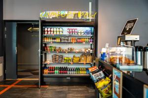 a refrigerator filled with lots of food and drinks at Comfort Hotel Xpress Tromsø in Tromsø +24 photos