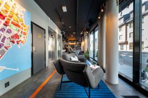 a row of chairs in an office lobby at Comfort Hotel Xpress Tromsø in Tromsø