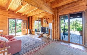 a living room with a couch and a flat screen tv at Beautiful Home In Guardamar Del Segura in El Camino de Catral