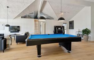 a living room with a pool table in it at Amazing Home In Glesborg With Sauna in Fjellerup +6 photos