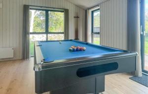 a room with a pool table with balls on it at Amazing Home In Sjællands Odde With Sauna in Yderby +13 photos