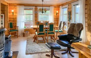 a dining room with a table and chairs at Pet Friendly Home In Lesjaskog With Wifi in Bjorli
