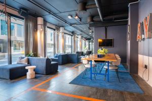 a dining room with a table and chairs at Comfort Hotel Xpress Tromsø in Tromsø