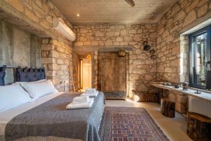 Ένα ή περισσότερα κρεβάτια σε δωμάτιο στο Villa Faros