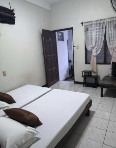 Ένα ή περισσότερα κρεβάτια σε δωμάτιο στο Placido's Vacation Home +27 φωτογραφίες