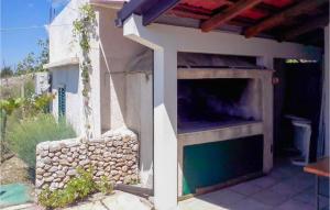 a large outdoor oven with a stone wall at Beautiful Home In Bol in Bol +11 photos