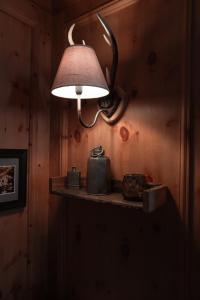 a lamp on a shelf in a room at Löw Chalet Suite 3 in the heart of Kitzbühel by 360 Estates in Kitzbühel
