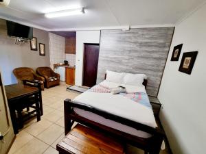 TV a/nebo společenská místnost v ubytování Sundown Lodge