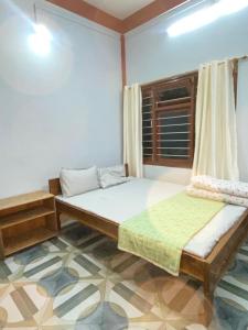 Postel nebo postele na pokoji v ubytování Sirful Homestay