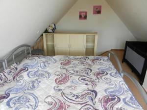 Ένα ή περισσότερα κρεβάτια σε δωμάτιο στο Ferienhaus Nordseesonne