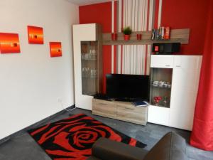 Μια τηλεόραση ή/και κέντρο ψυχαγωγίας στο Ferienhaus Nordseesonne