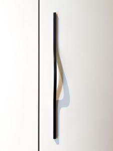 a door handle on a white door at Continental Apartment Unirii in Cluj-Napoca +4 photos