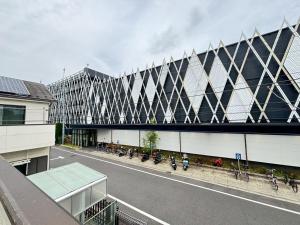 an external view of a building with bikes parked outside at K5 Building - Vacation STAY 20273 in Nabegayato
