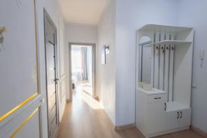 a white bathroom with a sink and a mirror at New апартаменты возле Материнства и Детства in Taldykolʼ +78 photos