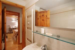 a bathroom with a counter top and a mirror at Matteo's apartment by Alpenwhite in Livigno +19 photos