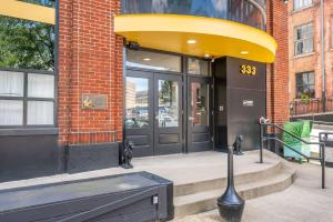 a store front of a building with a large door at The 333 Suites 301 - Suite for 6 in Cincinnati +39 photos