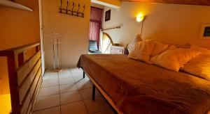 En eller flere senge i et værelse på Duplex face aux pistes La Foux d'Allos