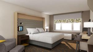 a hotel room with a bed and a window at Holiday Inn Chicago Midway Airport S by IHG in Chicago