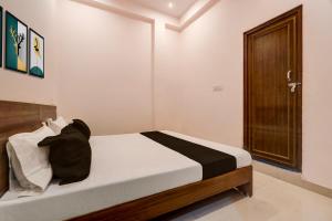 Ένα ή περισσότερα κρεβάτια σε δωμάτιο στο Hotel O Haven Palace +20 φωτογραφίες