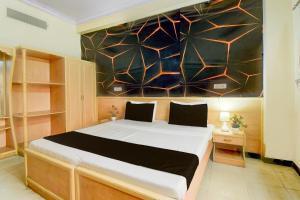 Postel nebo postele na pokoji v ubytování Collection O Albert Hall Museum Jaipur Formerly Roop Palace