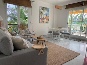 a living room with a couch and chairs and tables at Marbella - Puerto Banus in Marbella