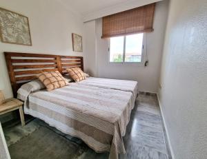 a bedroom with a large bed with a window at Marbella - Puerto Banus in Marbella +28 photos