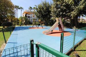 a playground with a slide in a park at Marbella - Puerto Banus in Marbella