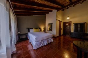 a bedroom with a bed in a room at Ancestral Copan in Copan Ruinas