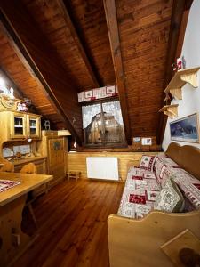a room with a bed and a desk in a room at Casa Izabella in Tarvisio +22 photos