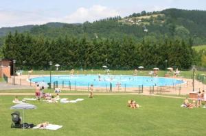 a group of people in a large swimming pool at Casa Hegoa in Elgóibar