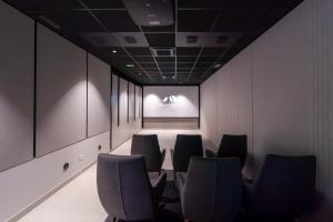 a conference room with chairs and a projection screen at Apartamentos - Delfin Natura in L'Alfas del Pi +19 photos
