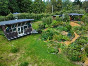 an aerial view of a garden with a house at Sixty Six in Broadwood