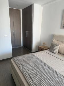 Postel nebo postele na pokoji v ubytování Jardin de Carthage + 2 fotografie