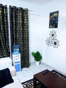 a living room with a couch and a table at Talla Homes in Mombasa