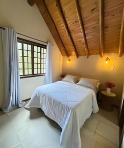 En eller flere senge i et værelse på Chalé Vermont | Privacidade & Sofisticação