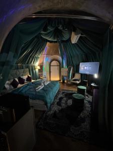 a room with a bed and a tv in a tent at Ufo Mussoorie in Mussoorie +21 photos