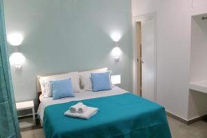 Postel nebo postele na pokoji v ubytování b&b il gioiello