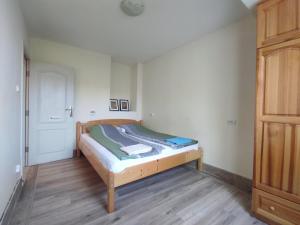 a small bedroom with a bed and a closet at 2 rooms apartment in the center in Nesebar