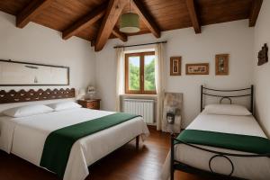 Postel nebo postele na pokoji v ubytování Villa Nasca - Paesaggi e Piscina privata