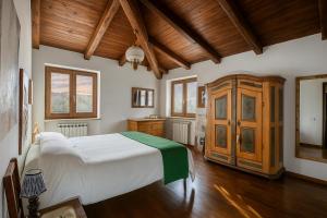 Postel nebo postele na pokoji v ubytování Villa Nasca - Paesaggi e Piscina privata + 14 fotografií